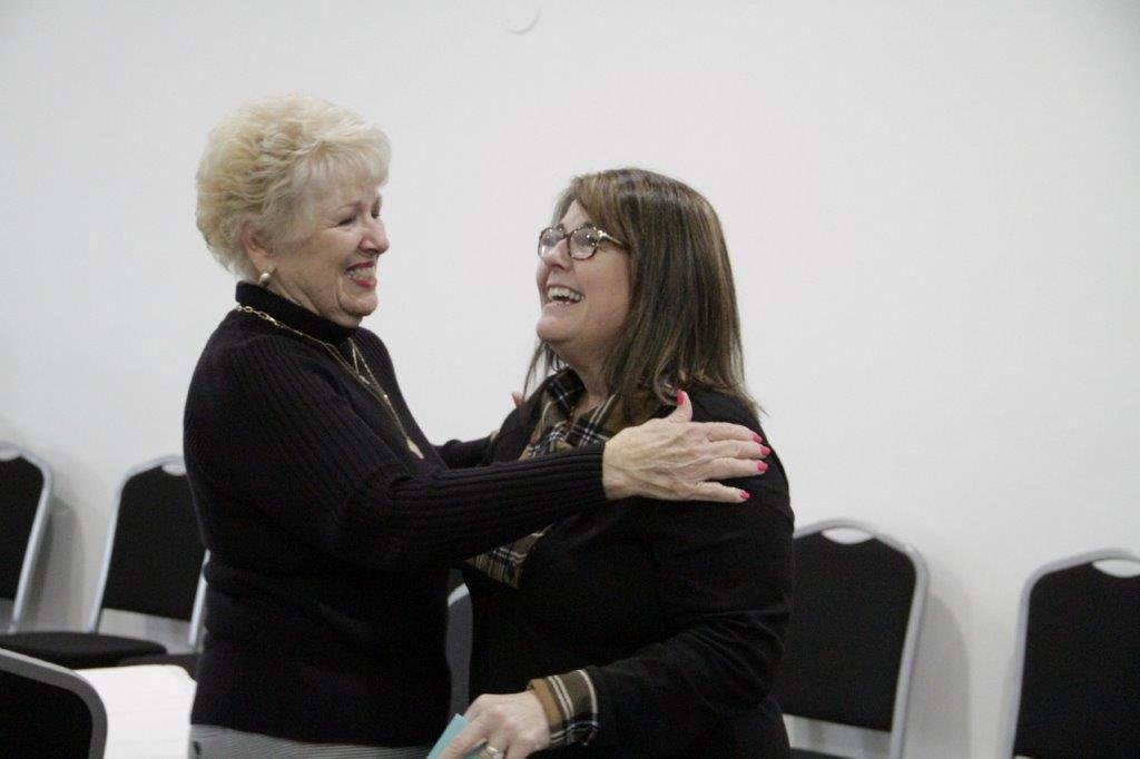 Annette Simpkins (left) shares a moment with retiring QISD Superintendent Rhonda Turner at a special reception held last Friday for the retiring school administrator.